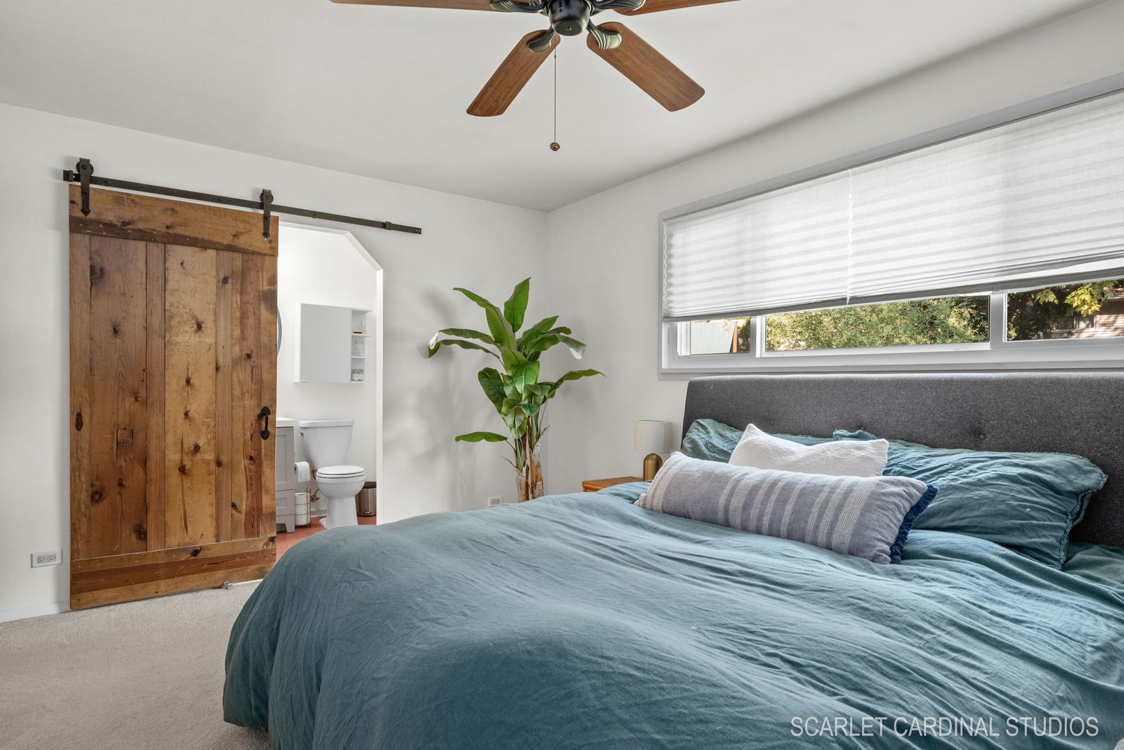1215 Windsor Drive Wheaton, IL 60189 - Photo 13 of 32 a bedroom with a large bed and a chandelier