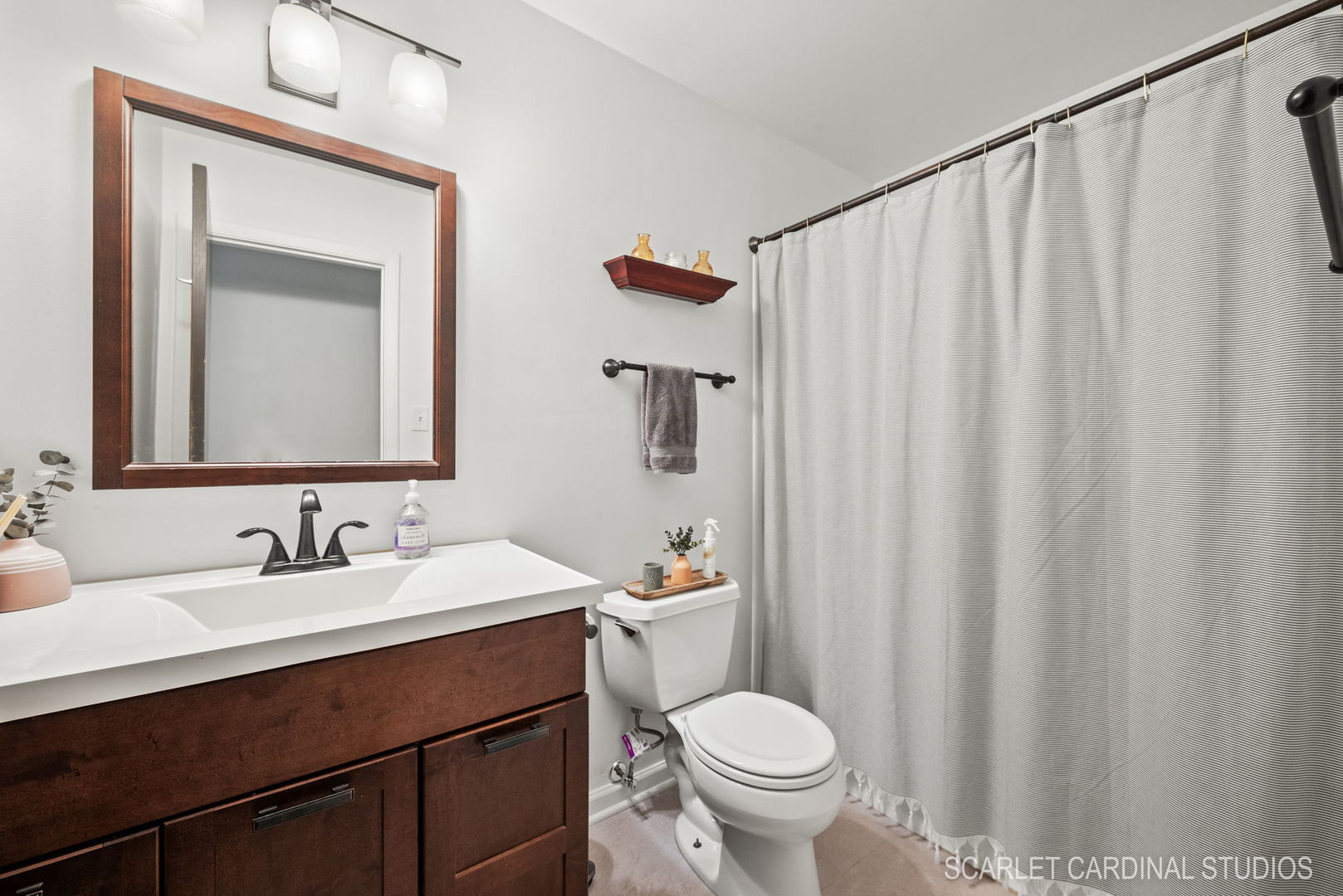 1215 Windsor Drive Wheaton, IL 60189 - Photo 16 of 32 a bathroom with a sink a toilet and a mirror