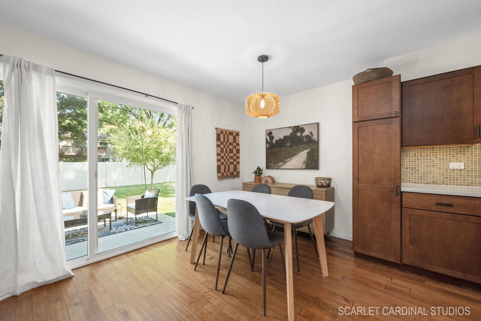 1215 Windsor Drive Wheaton, IL 60189 - Photo 9 of 32 a view of a dining room with furniture a chandelier and wooden floor