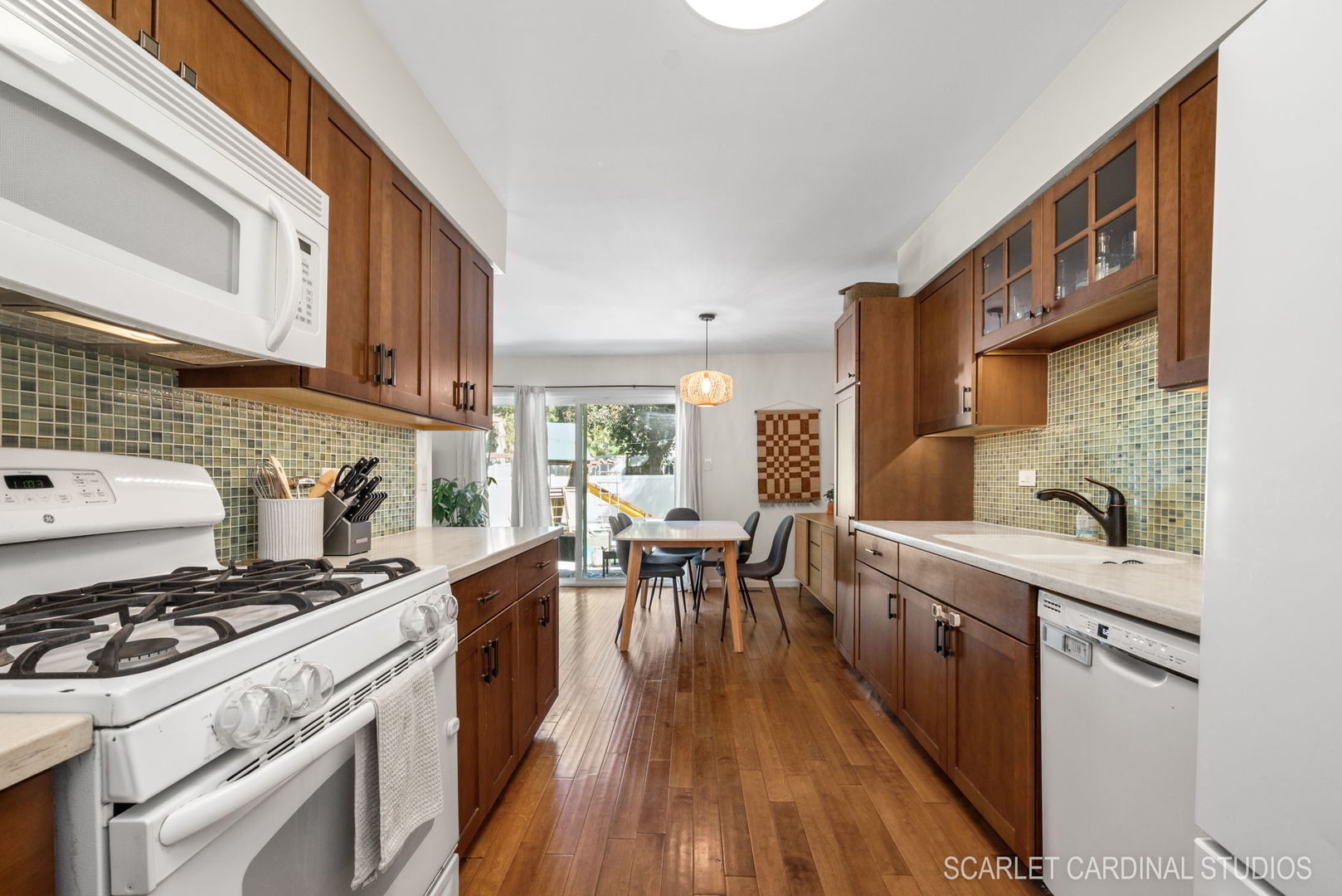1215 Windsor Drive Wheaton, IL 60189 - Photo 10 of 32 a kitchen with stove a sink and cabinets