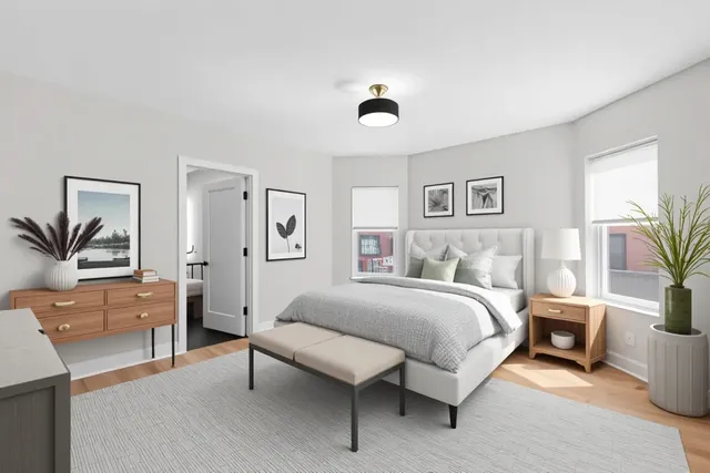 a bedroom with a large bed and a couch