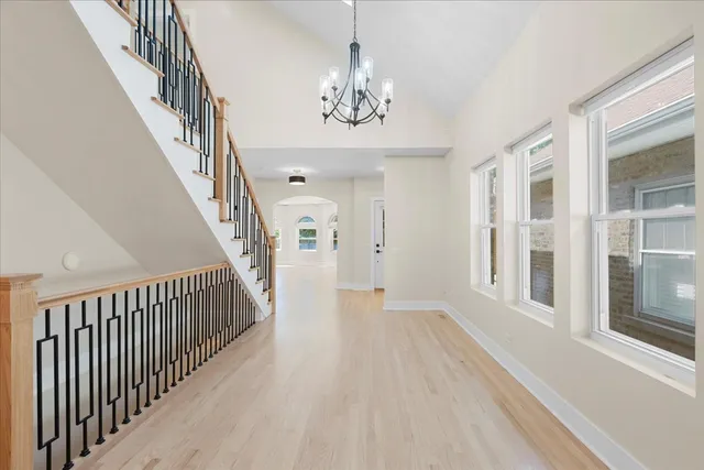 a view of an entryway with wooden floor