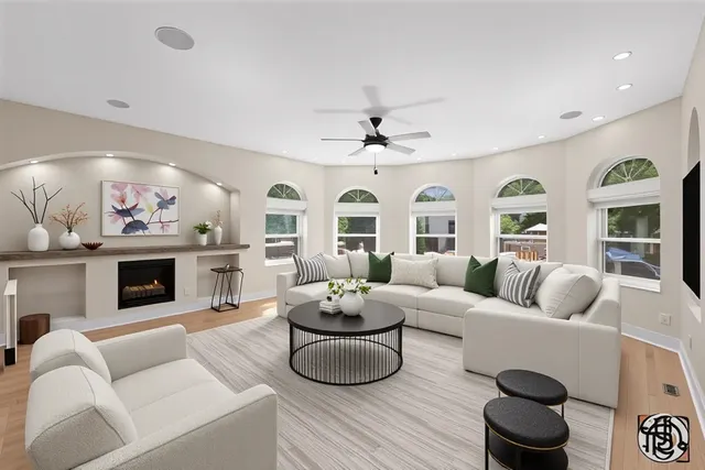 a living room with furniture fireplace and window