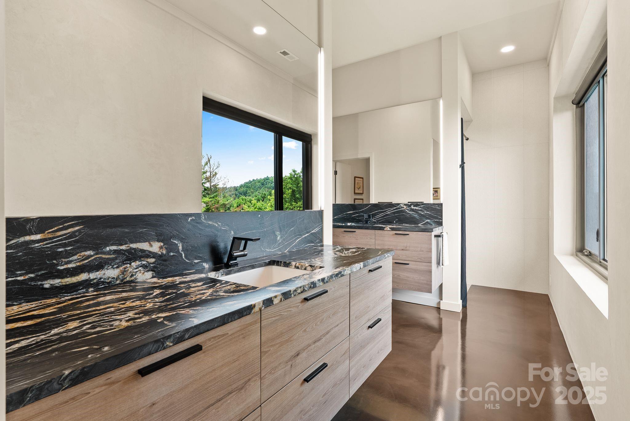 1045 Graham Road Marshall, NC 28753 - Photo 17 of 48 a kitchen with a stove and white cabinets