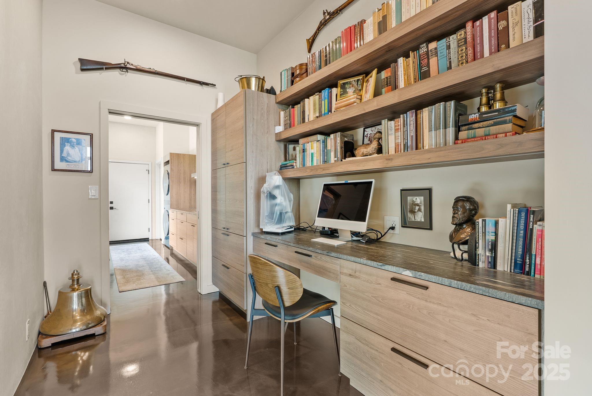 1045 Graham Road Marshall, NC 28753 - Photo 21 of 48 a view of a workspace with furniture bookshelf and a window