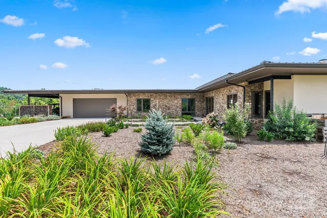 a front view of house with yard and green space