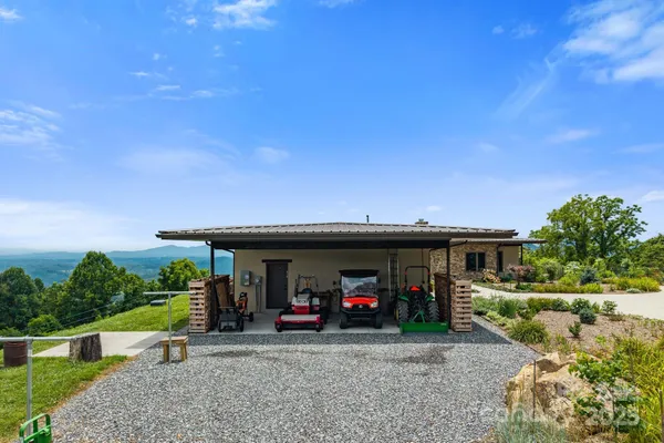 a view of a car park in front of house