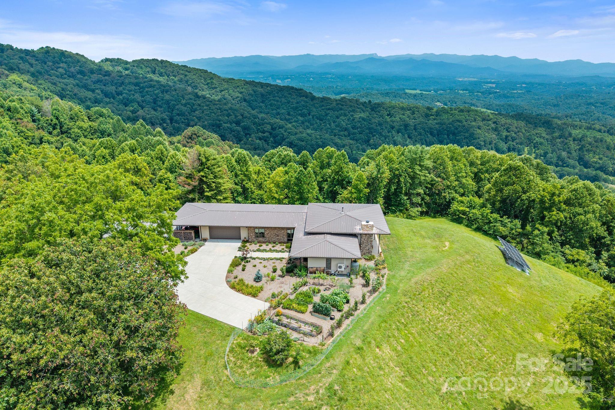 1045 Graham Road Marshall, NC 28753 - Photo 28 of 48 a view of a back yard from a garden