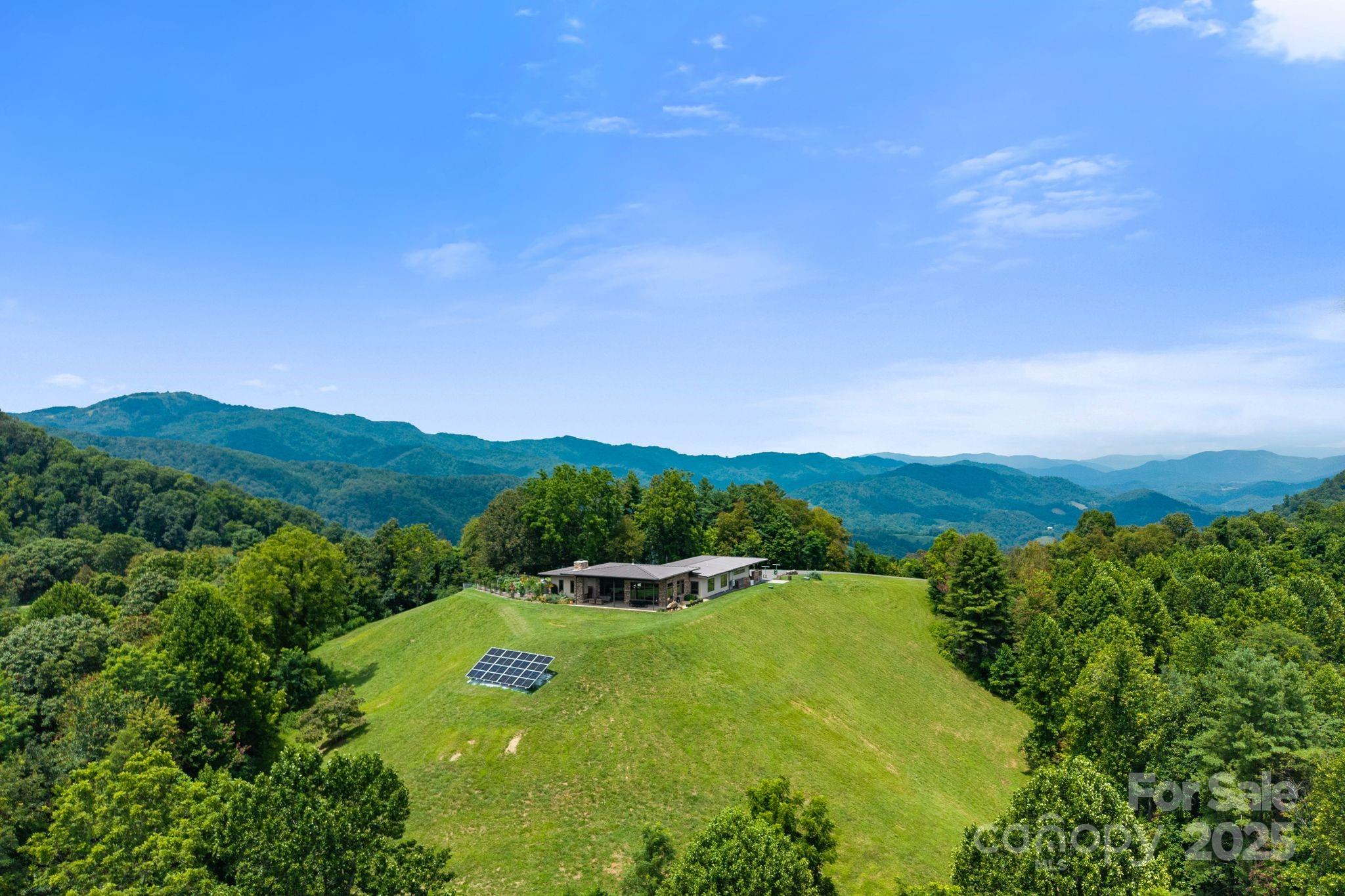 1045 Graham Road Marshall, NC 28753 - Photo 30 of 48 a view of a lake with a mountain in the background