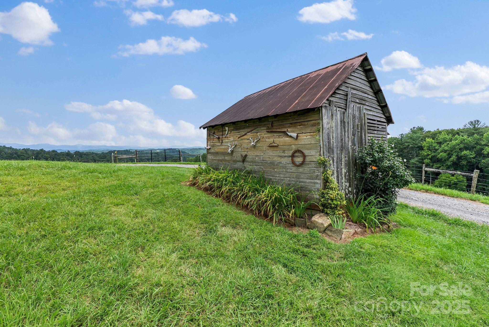 1045 Graham Road Marshall, NC 28753 - Photo 33 of 48 a front view of a house with garden