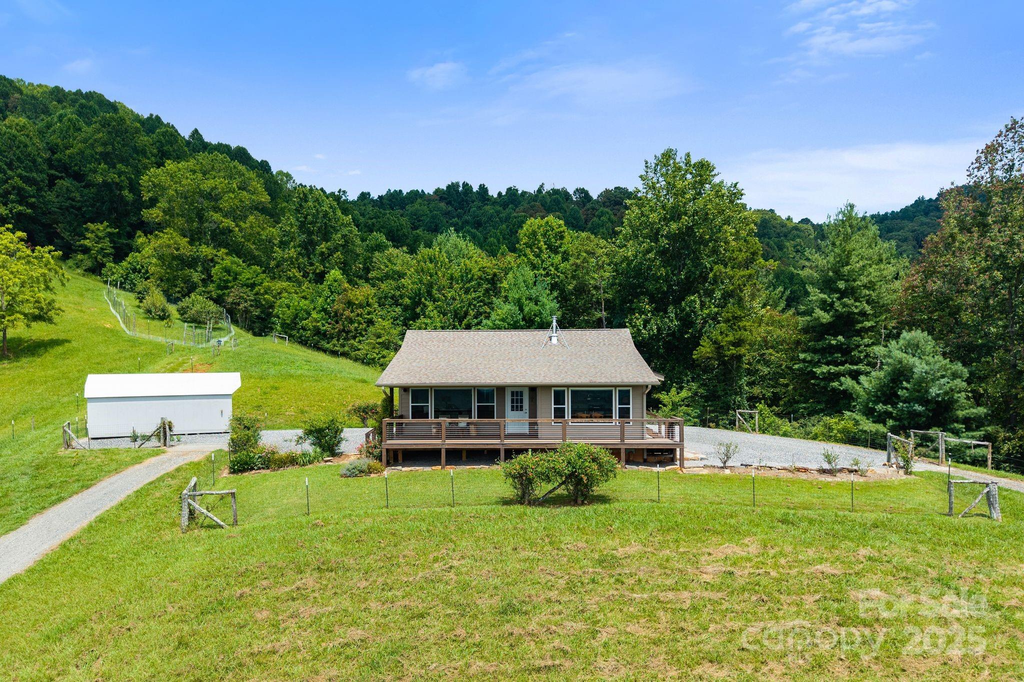 1045 Graham Road Marshall, NC 28753 - Photo 34 of 48 a view of a house with a big yard