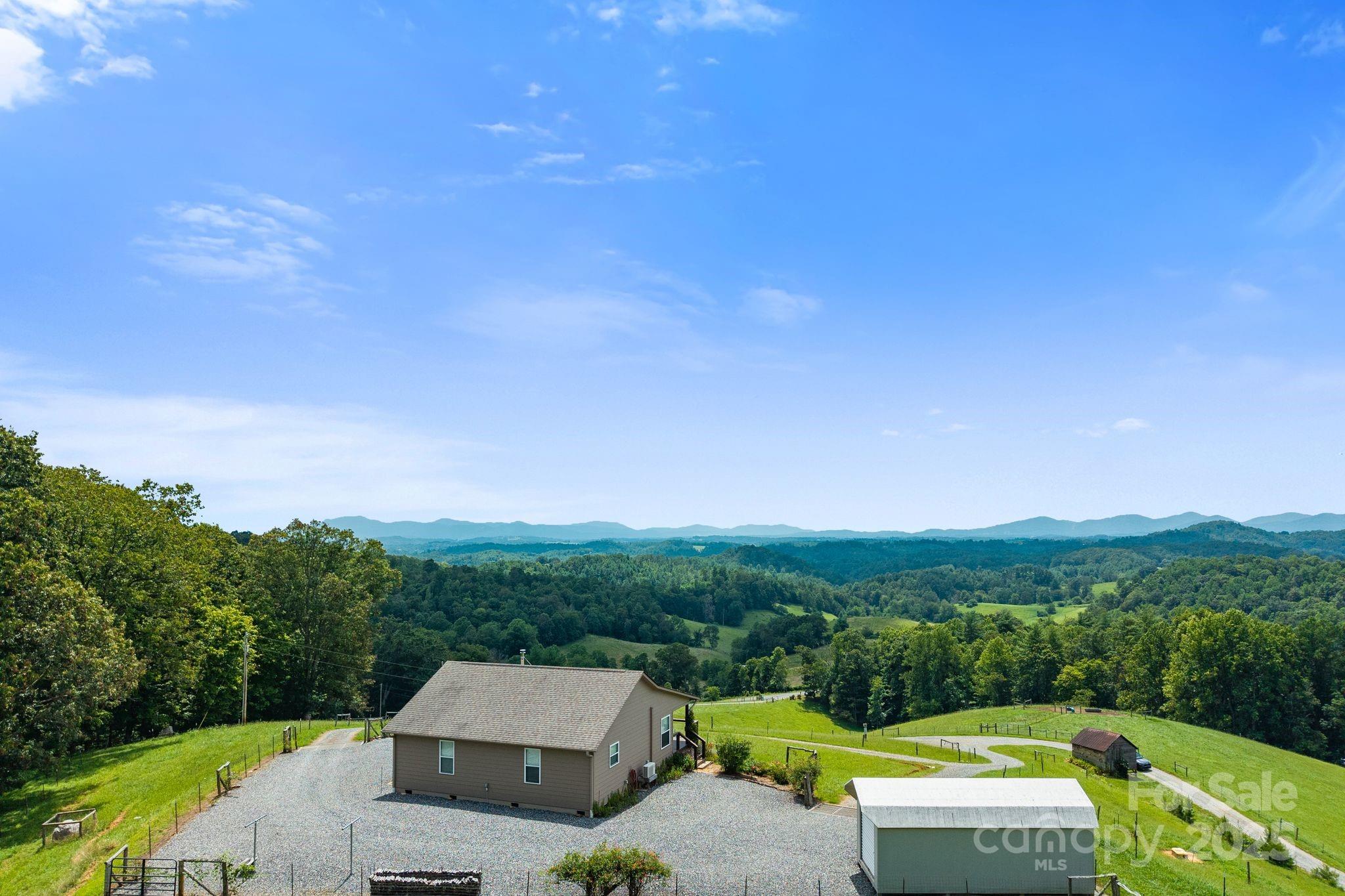 1045 Graham Road Marshall, NC 28753 - Photo 35 of 48 a view of a terrace with a garden