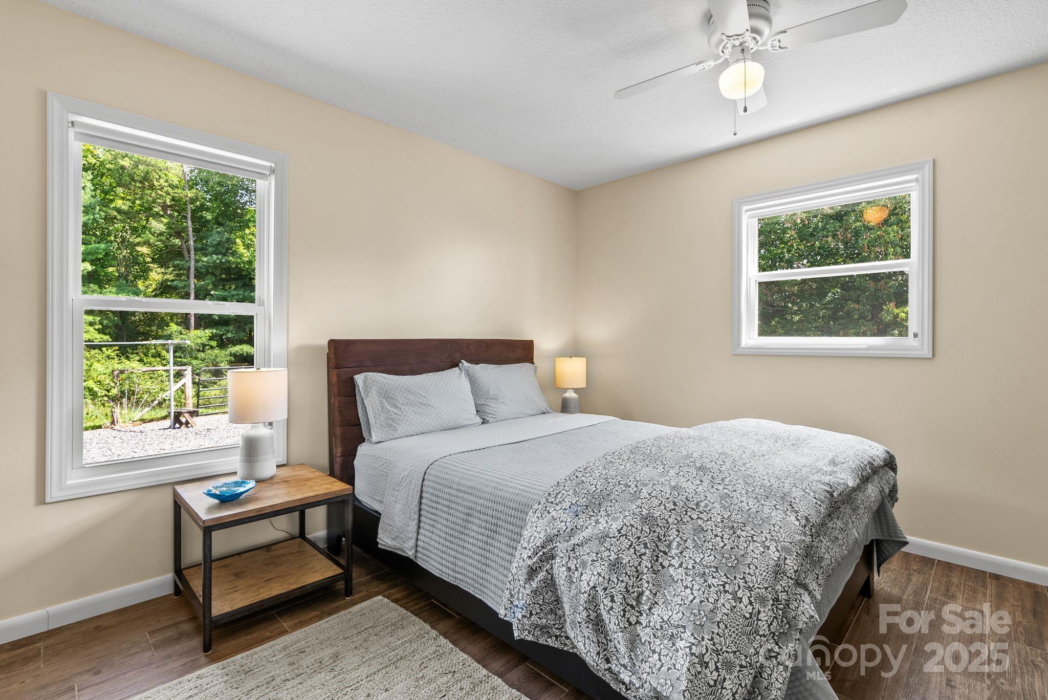 1045 Graham Road Marshall, NC 28753 - Photo 41 of 48 a bedroom with a bed and a window