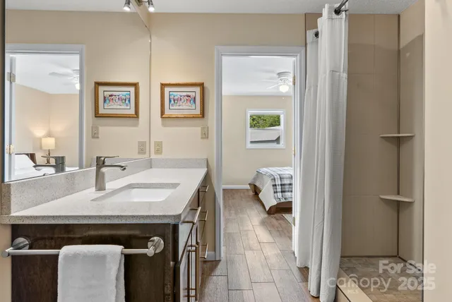 a en suite bathroom with a sink and a mirror