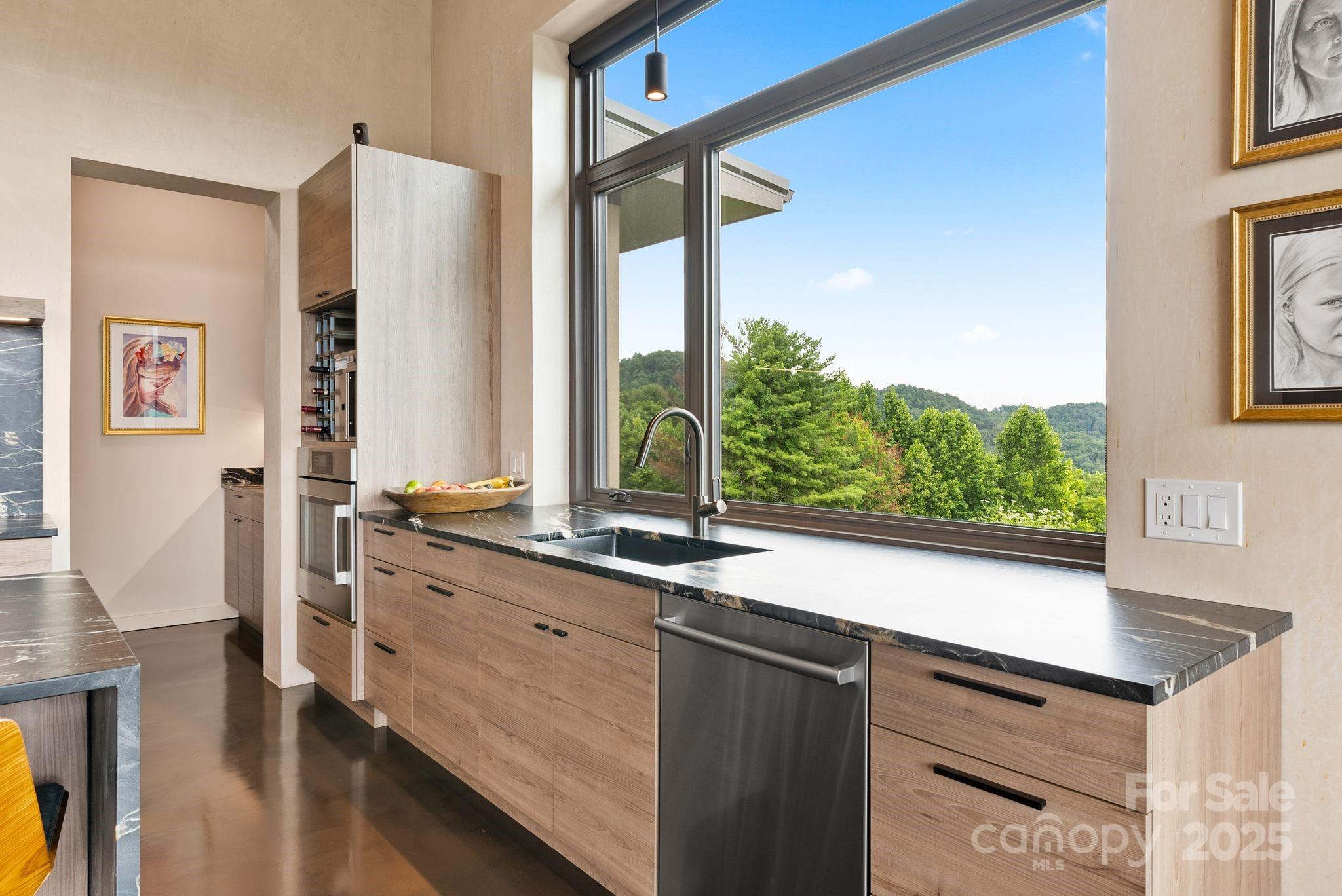 1045 Graham Road Marshall, NC 28753 - Photo 8 of 48 a kitchen with a sink and a large window