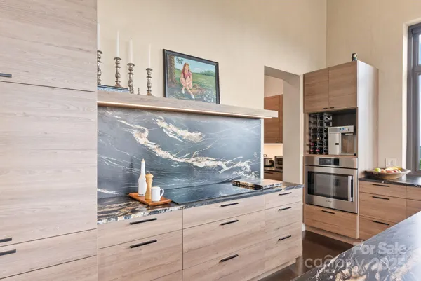 a room with cabinets and painting on the wall