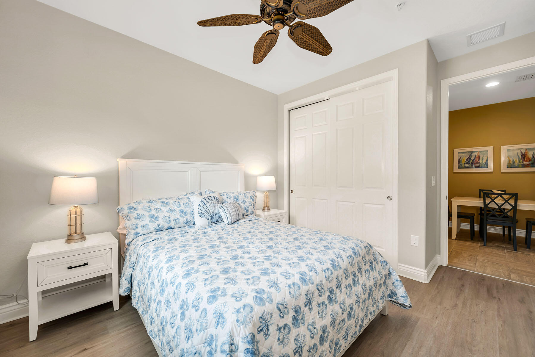 9066 Albion Lane North, Unit 5101 Naples, FL 34113 - Photo 23 of 48 a bedroom with a bed and a chandelier
