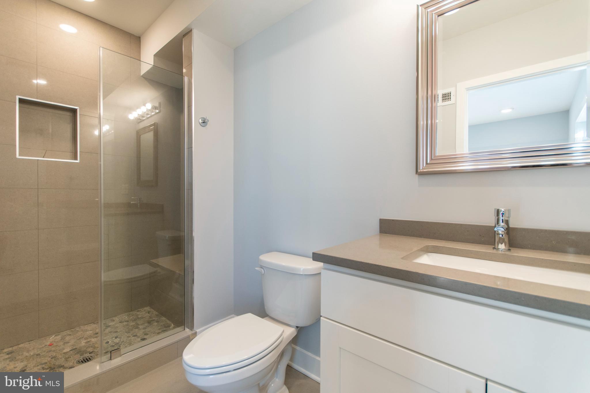 812 North Uber Street, Unit 6 Philadelphia, PA 19130 - Photo 17 of 25 a bathroom with a sink a toilet and shower