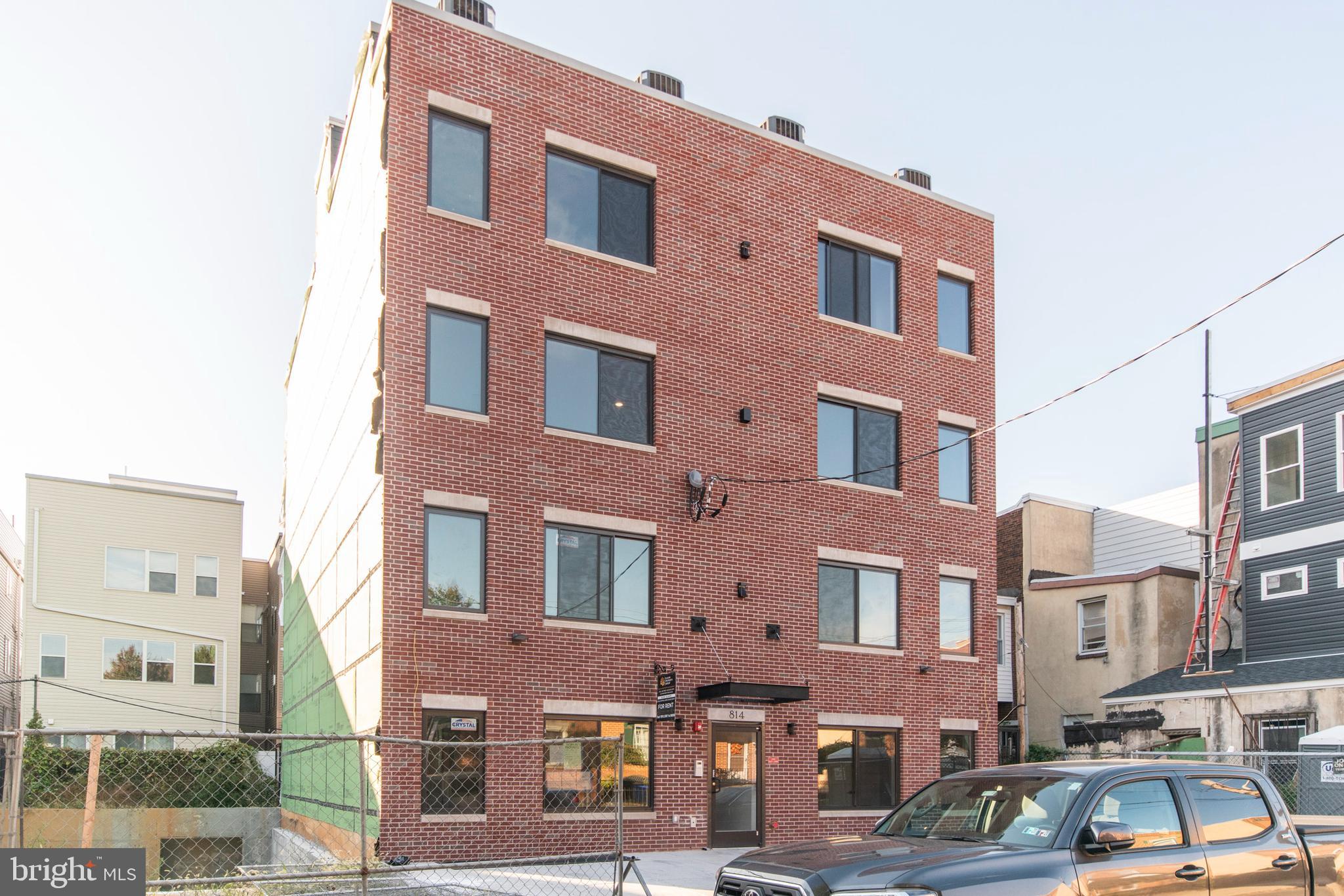 812 North Uber Street, Unit 6 Philadelphia, PA 19130 - Photo 25 of 25 a front view of a building with lot of cars parked on the roadside