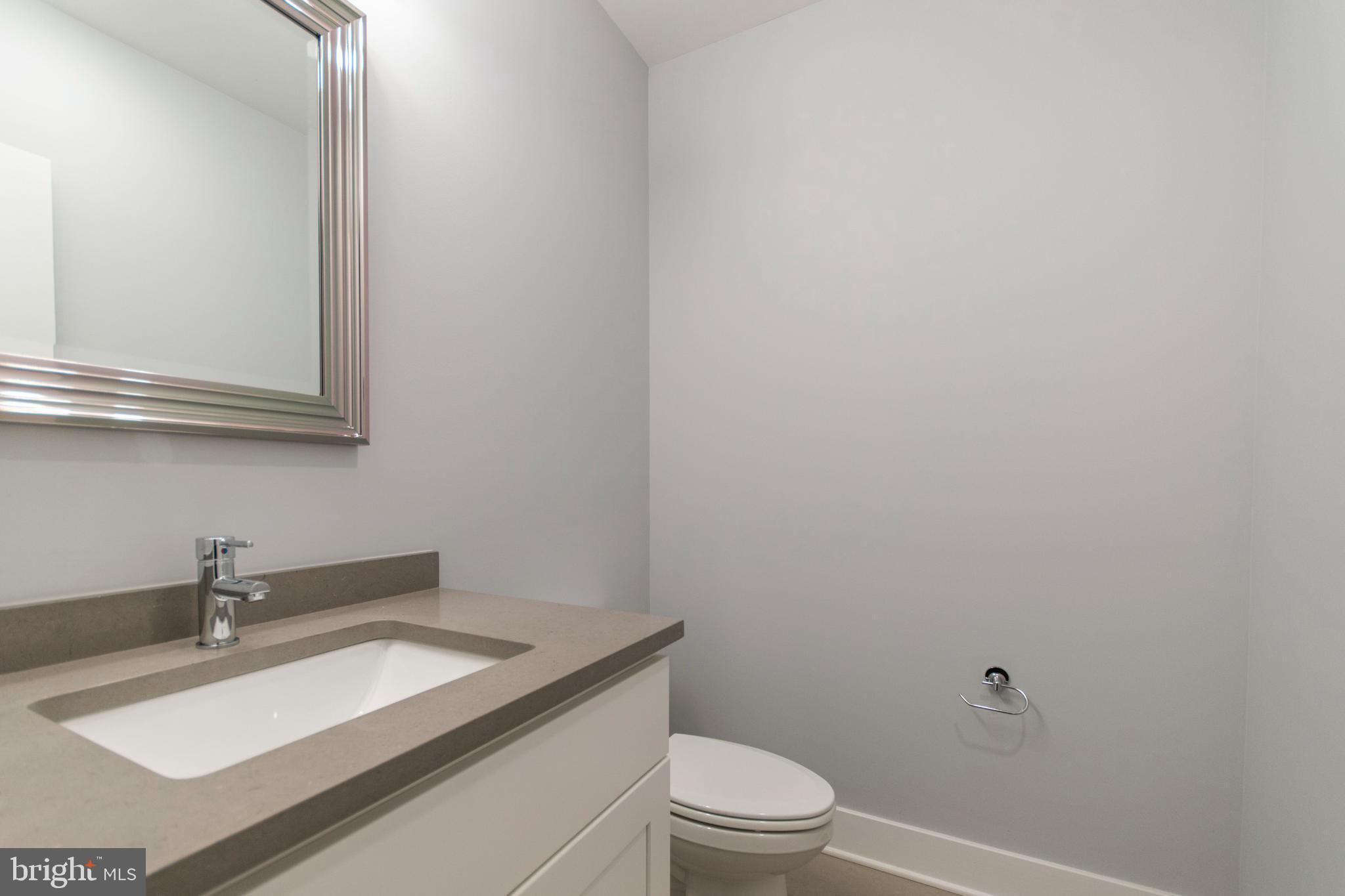 812 North Uber Street, Unit 6 Philadelphia, PA 19130 - Photo 10 of 25 a bathroom with a sink toilet and vanity