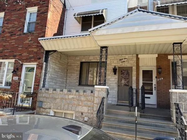a front view of a house with parking