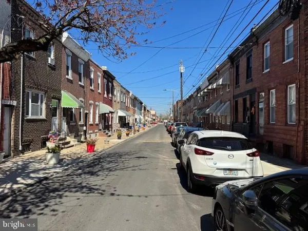 a view of a street with cars
