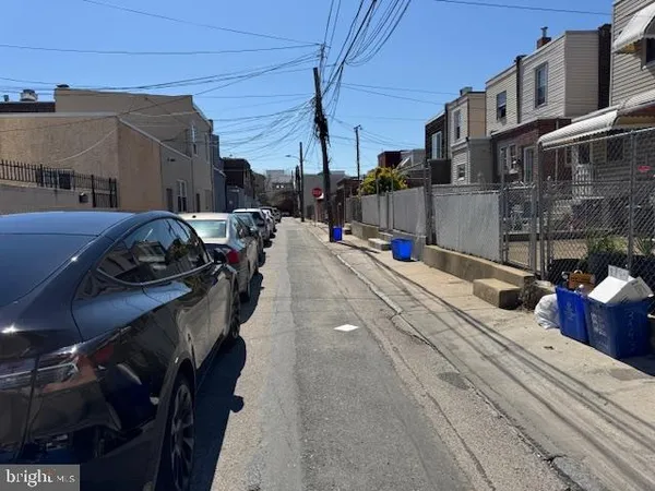 a view of a street with cars