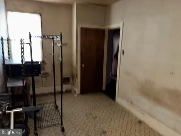 a view of a hallway with furniture