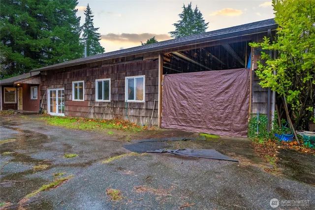 a view of a lake with a tree in the background