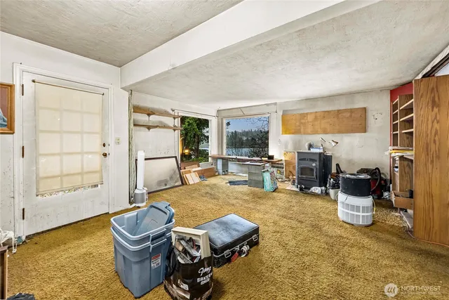 a living room with furniture a window and gym equipment