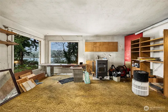 a bedroom with furniture and a window