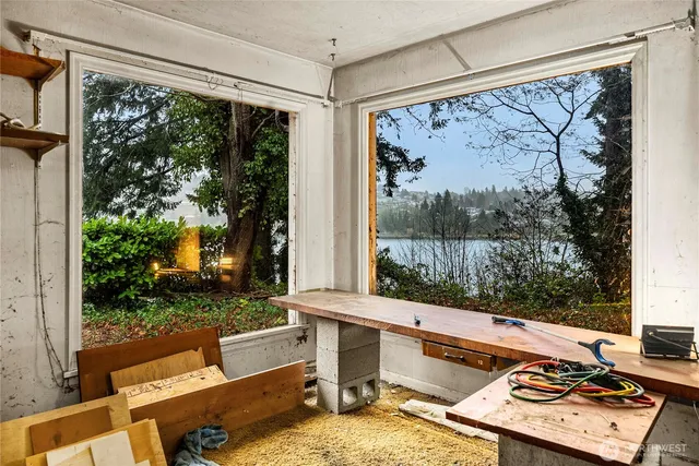 a view of a balcony with a table and chairs