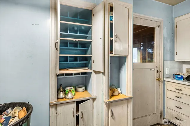 a kitchen with stainless steel appliances a stove a refrigerator and a cabinets