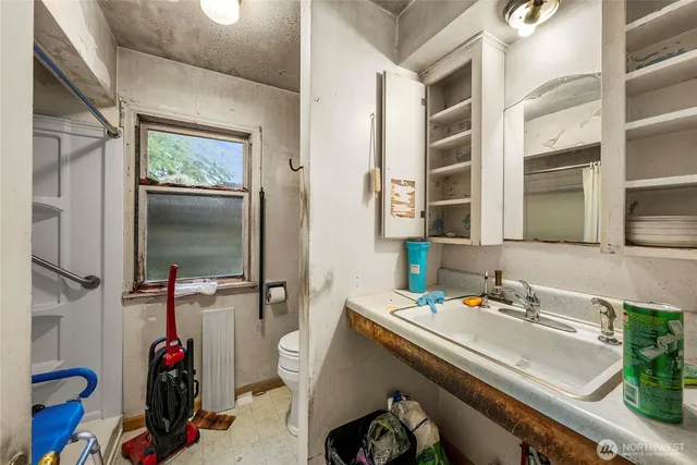 a kitchen with a sink and cabinets