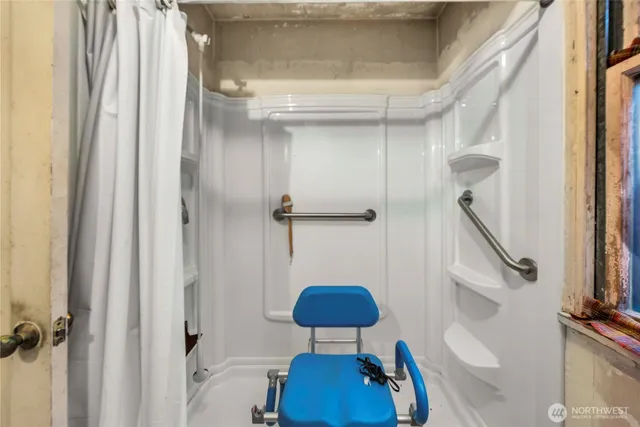 a bedroom with a bed and a mirror