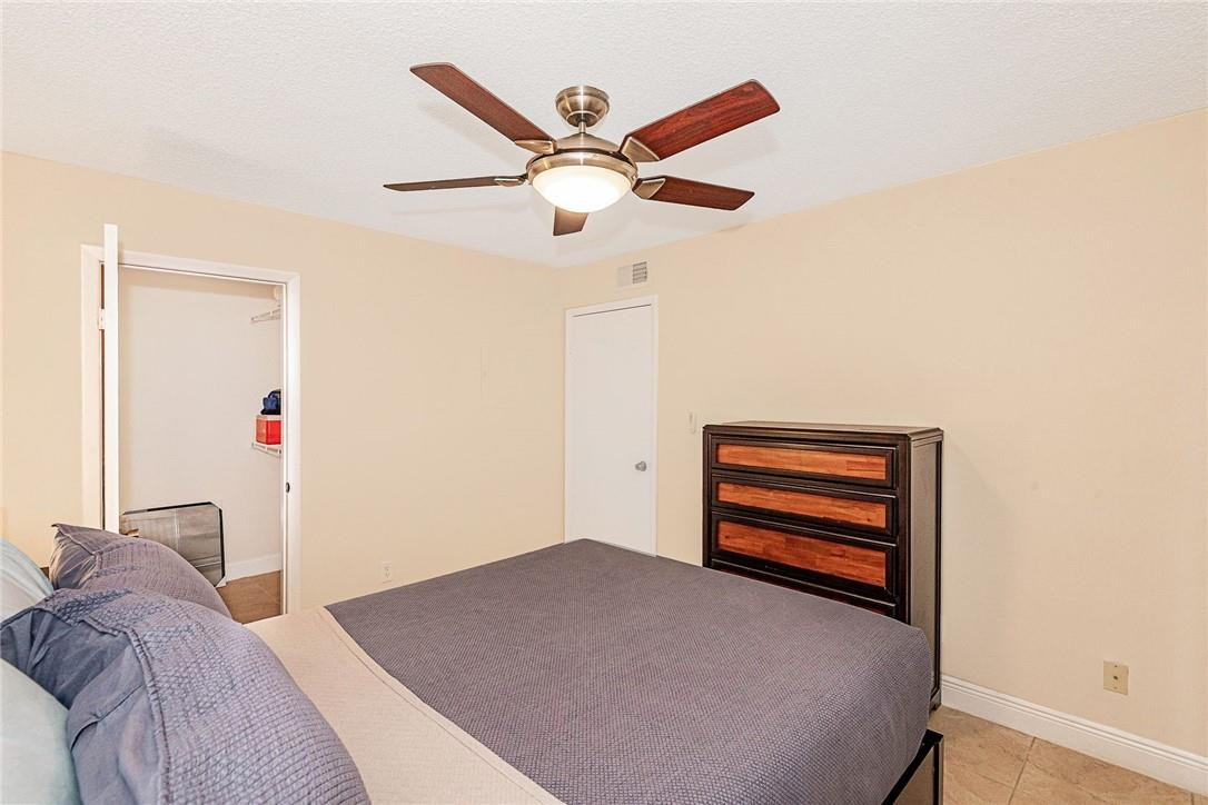 620 South Park Road, Unit 213 Hollywood, FL 33021 - Photo 17 of 28 a bedroom with a bed and a ceiling fan