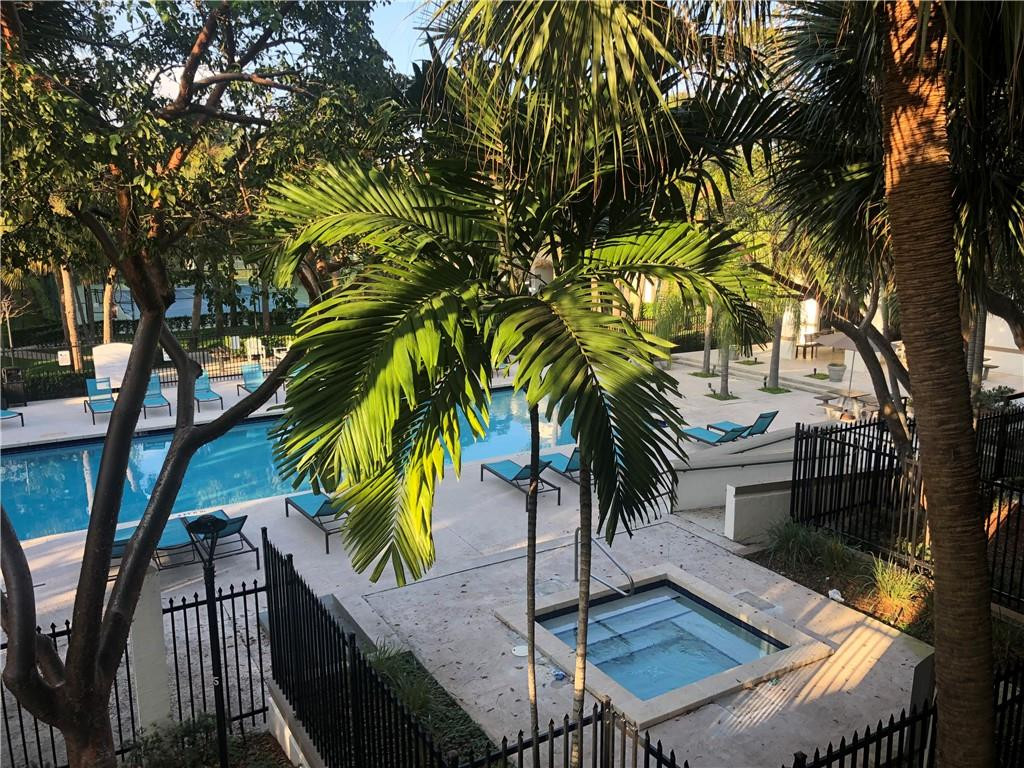 620 South Park Road, Unit 213 Hollywood, FL 33021 - Photo 26 of 28 a view of a backyard with a large tree