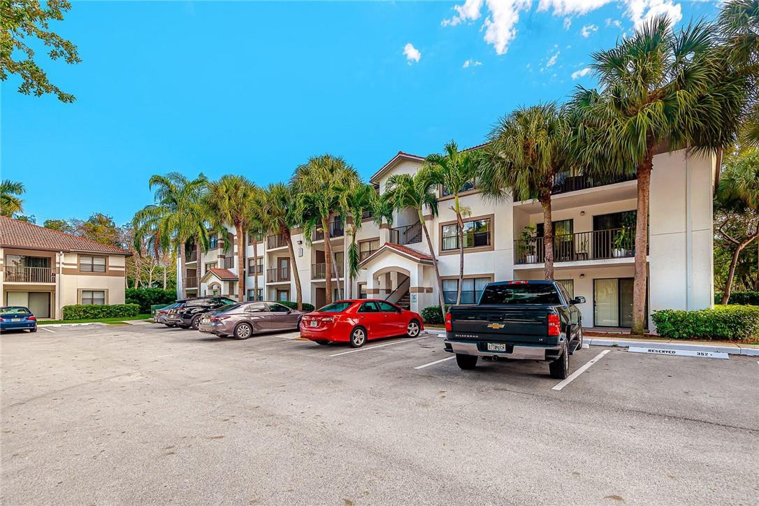 620 South Park Road, Unit 213 Hollywood, FL 33021 - Photo 28 of 28 a car parked in front of a building