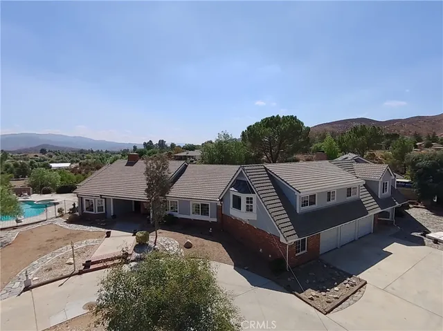 an aerial view of a house with a garden