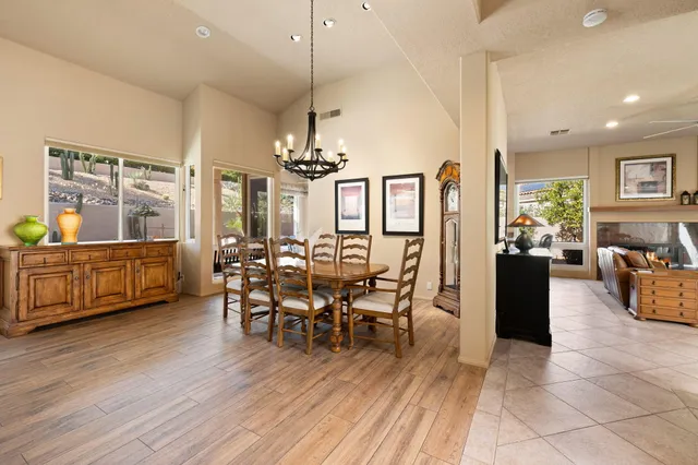 a view of a dining room with furniture window and outside view