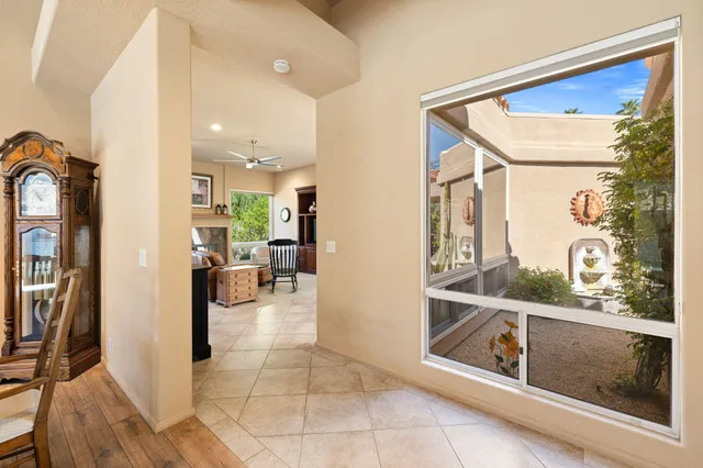 a dining room with furniture and window