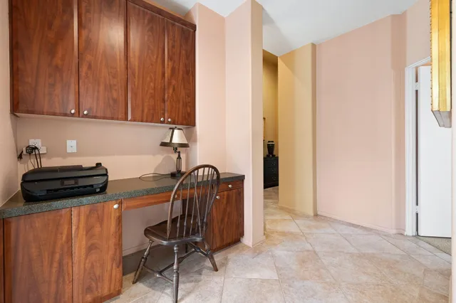 a spacious bathroom with a double vanity sink and a mirror