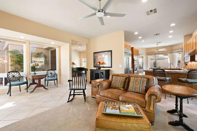 a view of a dining room with furniture wooden floor and chandelier