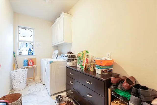 a room with furniture a rug and a window