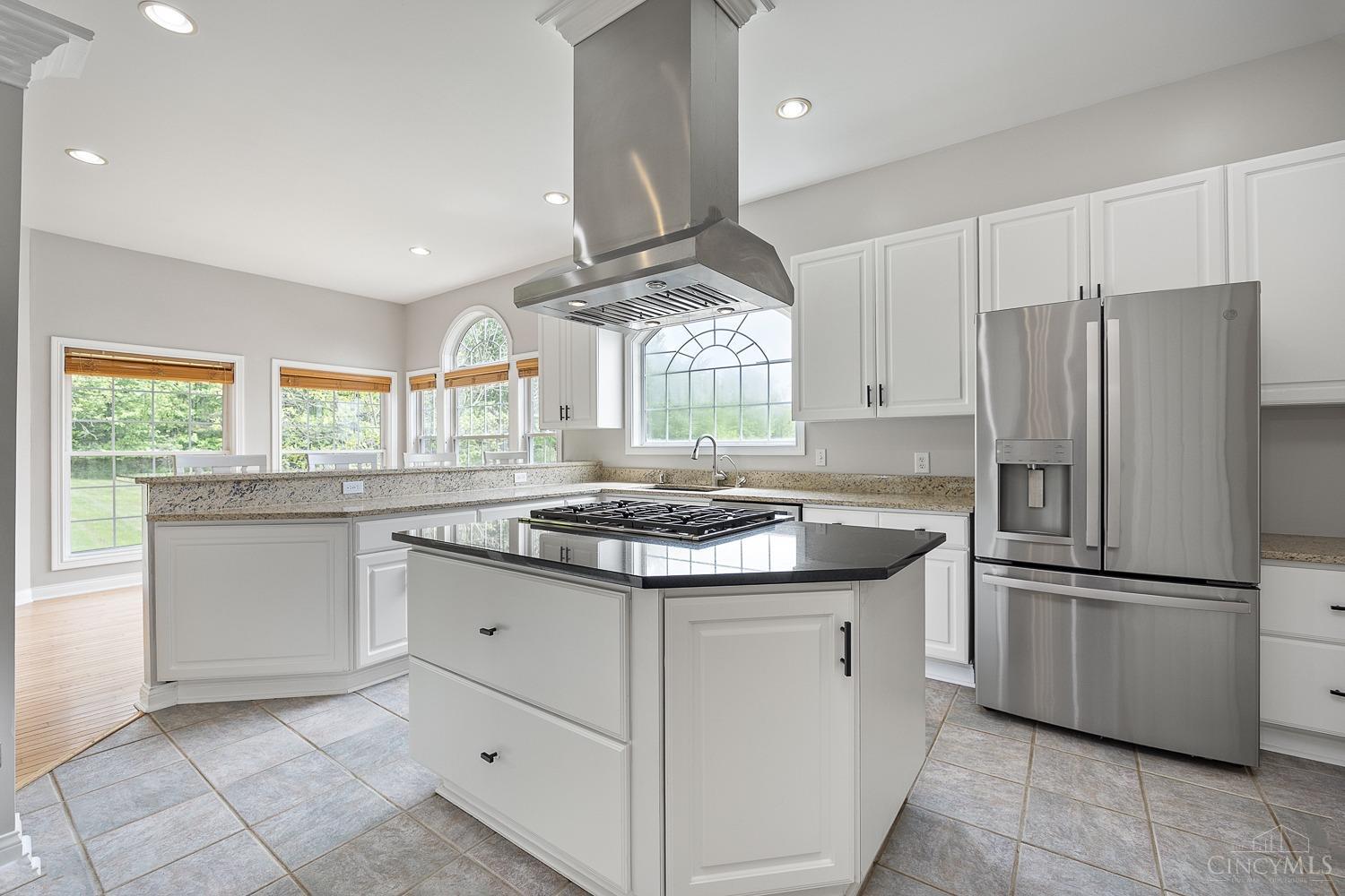 5409 Dry Run Road Milford, OH 45150 - Photo 51 of 89 Kitchen island with gas cooktop and hood vent