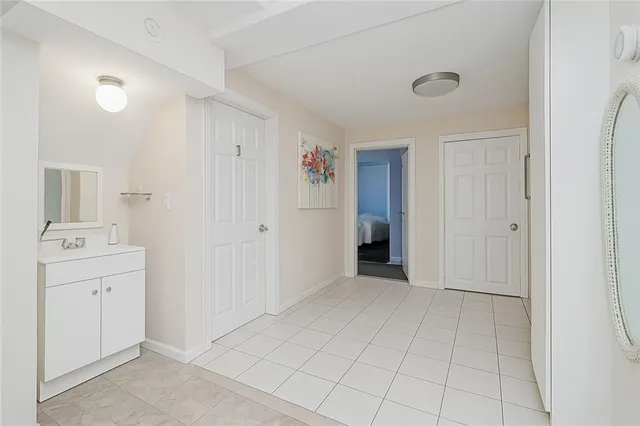 a spacious bedroom with a bed and a window