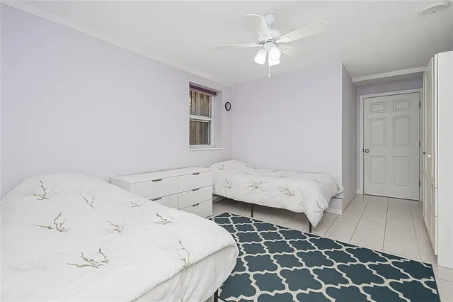 a room with two couches and chandelier