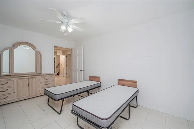 a view of a white building with a outdoor space