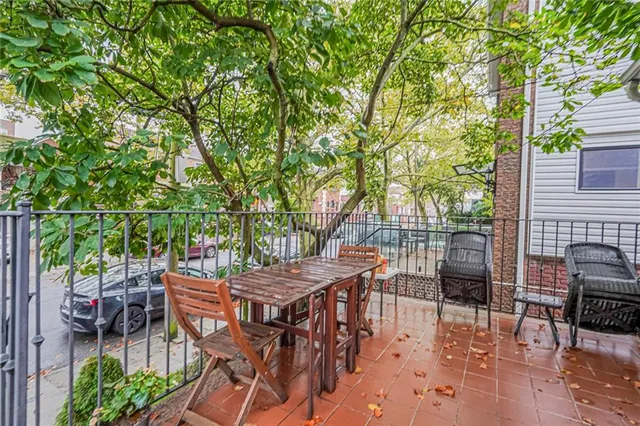 a view of a bedroom with a bed and a window