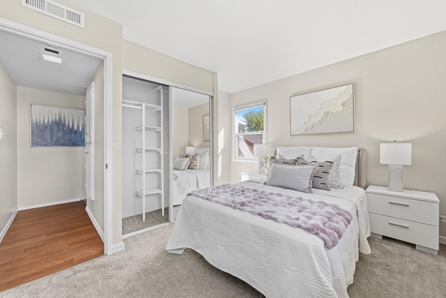 701 North Rengstorff Avenue, Unit 7 Mountain View, CA 94043 - Photo 22 of 32 a bedroom with a bed and a walk in closet